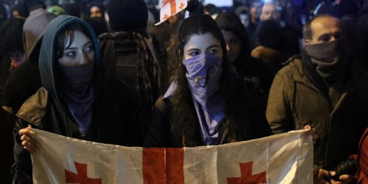 Georgia sees 3rd night of protests against ruling party’s suspension of EU talks – PBS