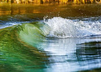 Watch: Massive River Wave Sweeps Surfer Out to Sea in Portugal – SURFER Magazine
